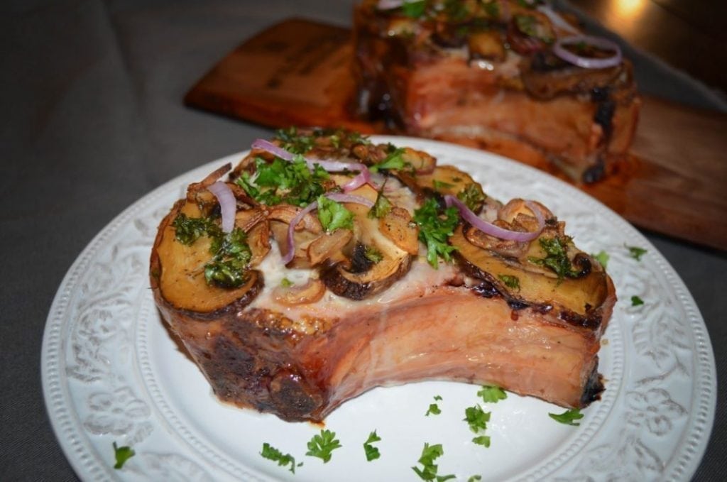 Maple planked pork chops recipe with mushrooms, scallions and parsley.
