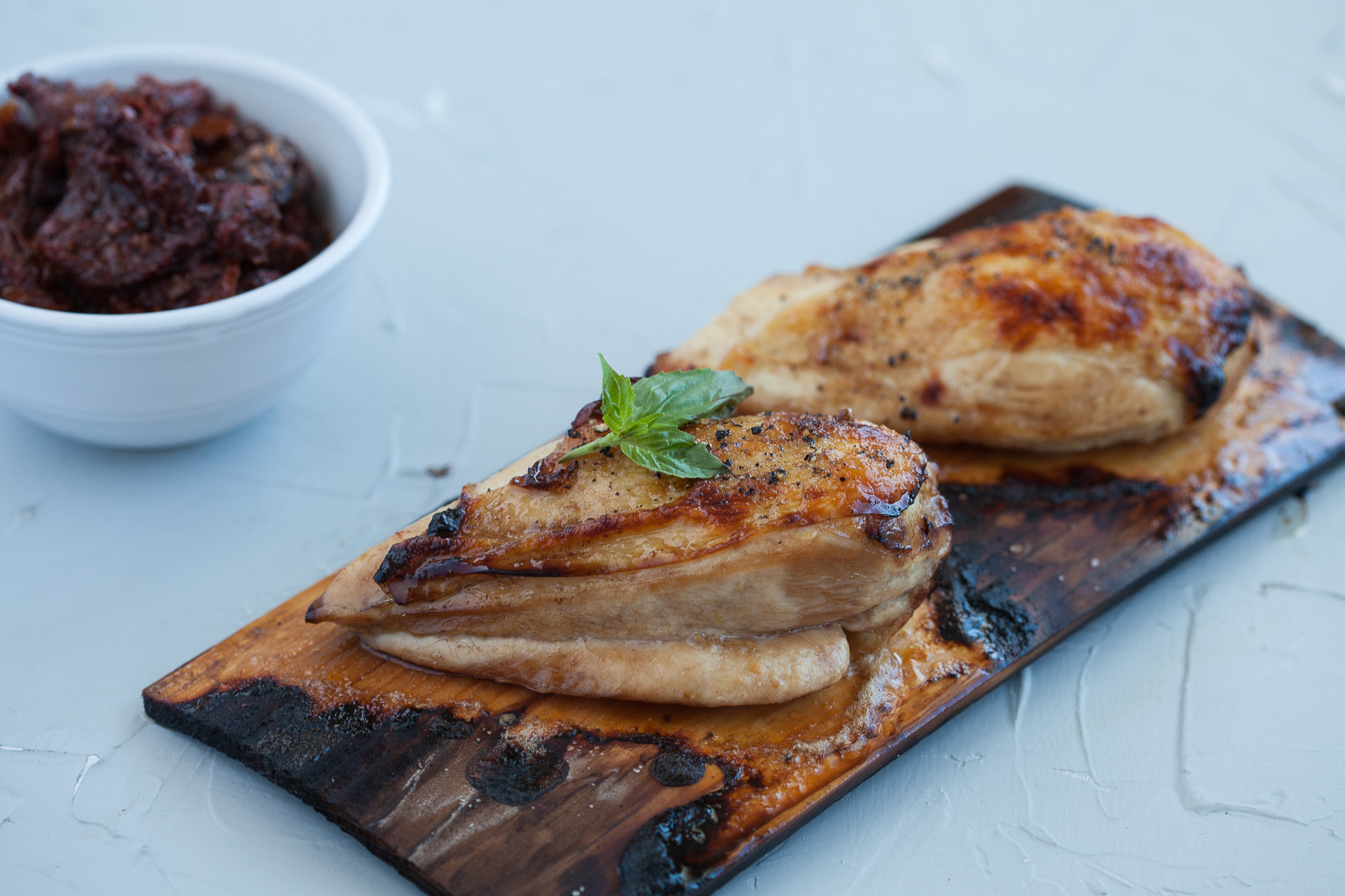Cedar Planked and Balsamic Marinated Chicken with Sundried Tomato and Basil