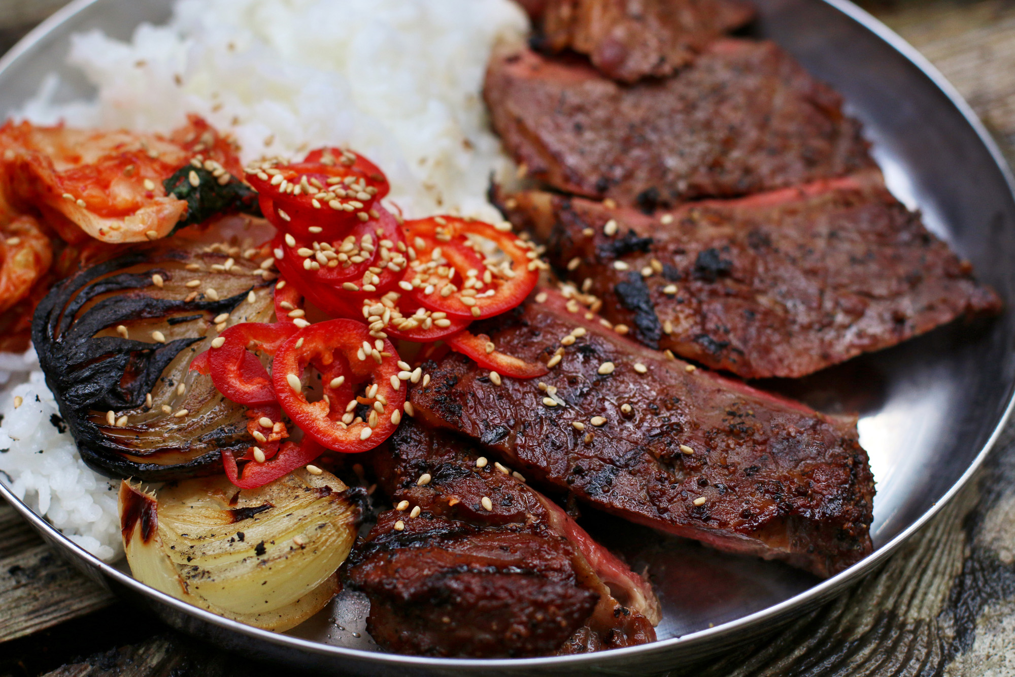 Cedar Planked Kalbi Marinated Steaks with Charred Onions